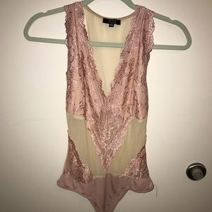 Pink and nude body suit